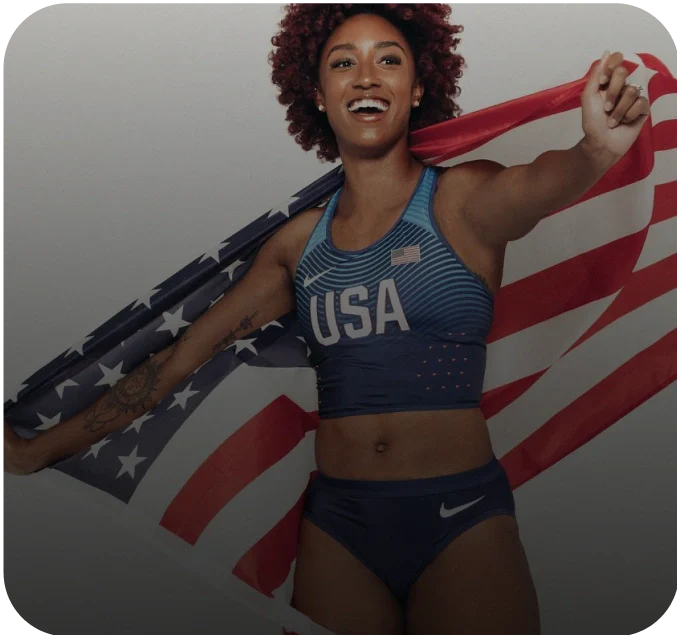 Photo of a woman holding an American flag while wearing a USA athletic outfit, labeled as Brianna McNeal, Olympic Runner.