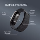 Image of the Band 2.0 fitness tracker on a dark background with the heading 'Built to be worn 24/7.' Labeled callouts point to different features: '14-day battery,' 'Patented soft-touch material,' 'Always tracking,' and 'Lightweight, breathable' strap.
