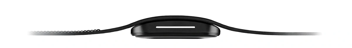Side profile view of a hume band 2.0  with a curved display and a thin black strap, centered on a light gray background. The watch face appears ultra-thin with a minimalist design and a narrow horizontal white indicator on the screen. 